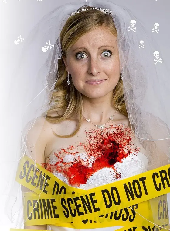 A bride in her veil holding a bloodstained bouquet behind crime scene tape