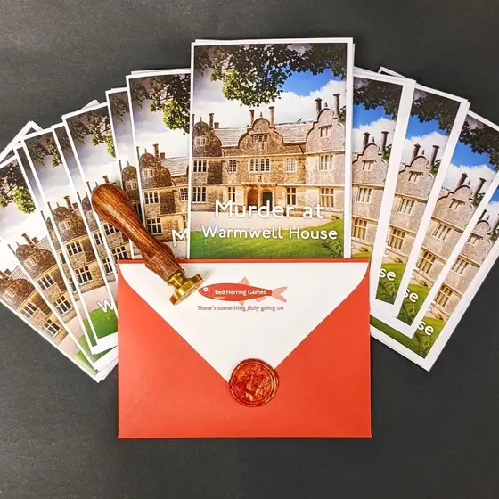 Murder mystery invitations and character cards fanned out from a red envelope