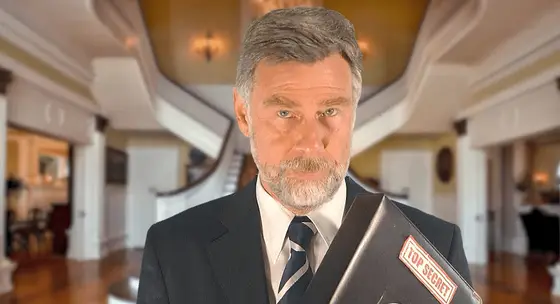 An actor playing the inspector, in a suit and tie
