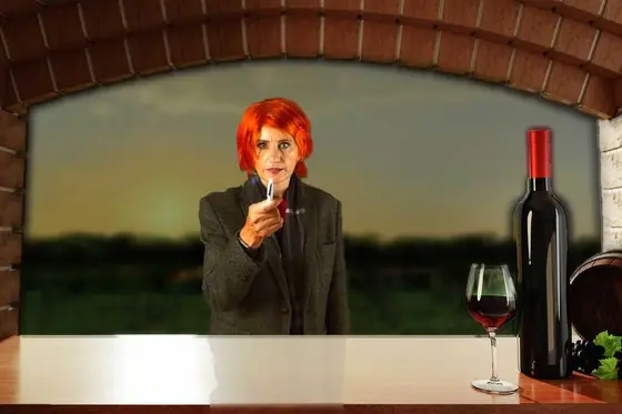 A suspect with a glass of red wine, at sunset