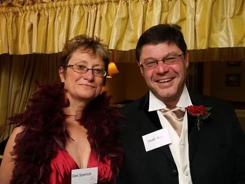 A couple in costume at a wedding murder mystery